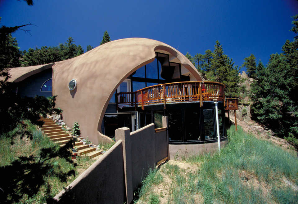 Garlock Home in the Colorado Rockies — It consists of 2 domes merged into a unique, kidney shape: a 32’ diameter garage gently blends into the larger, 50’ diameter shell placed 9’ below it. Home has 3 levels and 3800 square feet of living space.