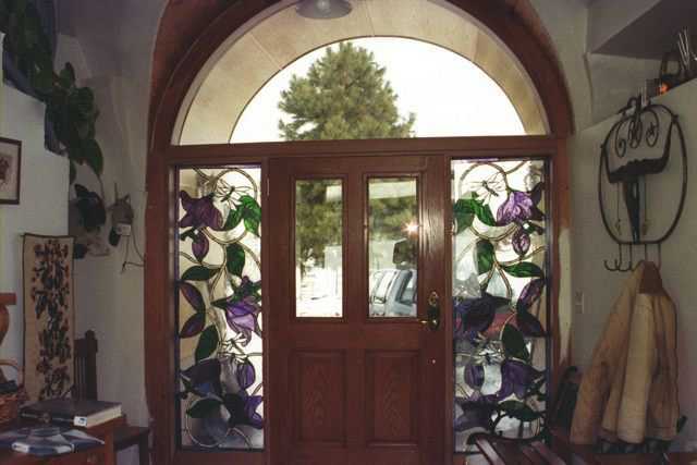 Beautiful sidelights — The design is hummingbirds, dragon flies, and flowers on vines.