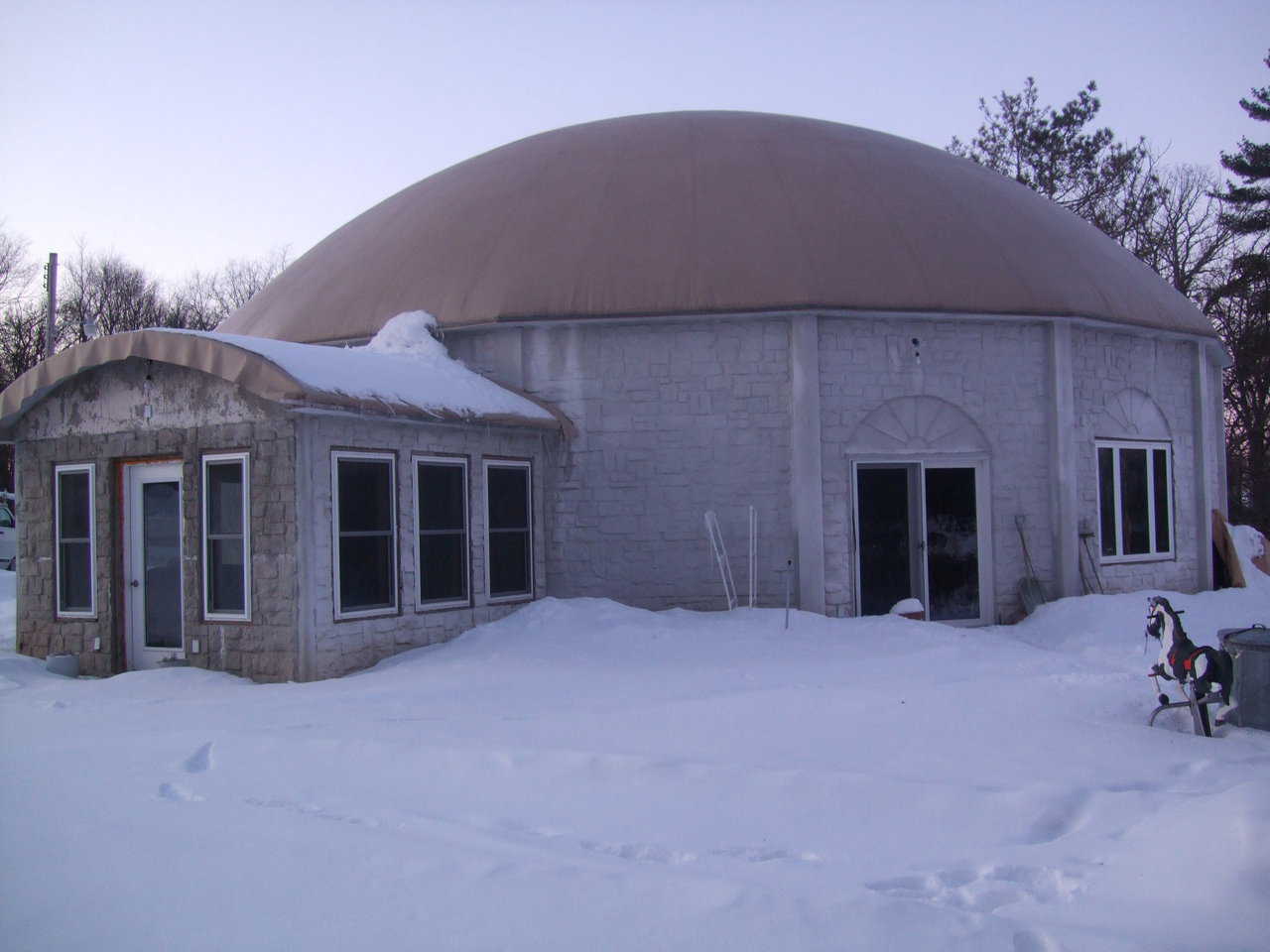 An Orion in Winter — The Pembers decided on an Orion, a Monolithic Dome style fashioned with straight walls or panels joined into a circle and topped by a dome.