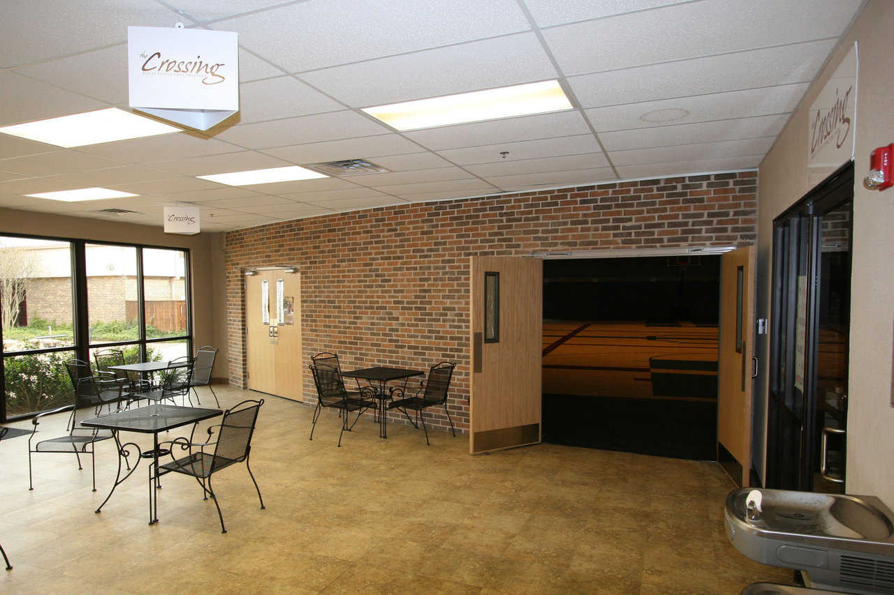 Transition Foyer — Leading into the dome, the foyer has tables and chairs where people can gather, enjoy refreshments and visit.