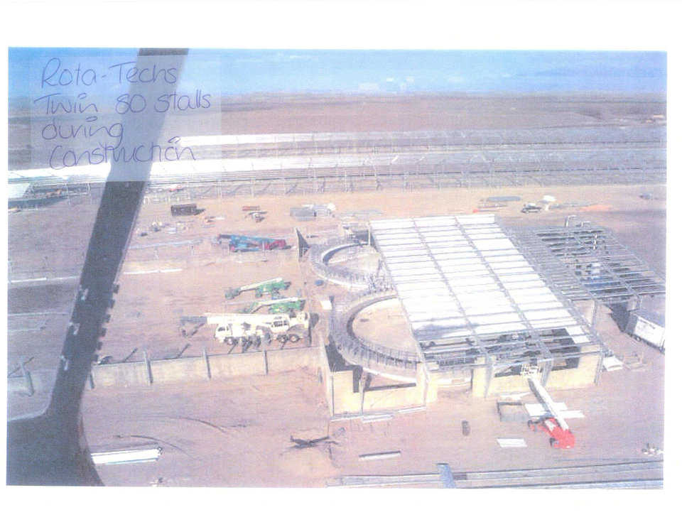 Aerial view underconstruction — It is impossible to efficiently cover a round structure with a square building.