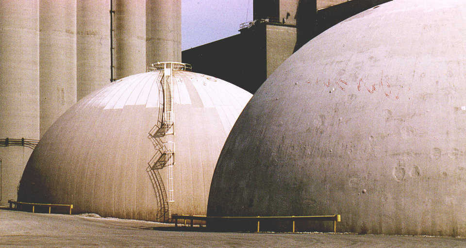Anderson’s Grain Storage — The building on the left is ready for recoating. It cannot be let go any longer or the Airform will delaminate and come off. The building on the right was let go to the point where the Airform had to be stripped. It has been recoated, but it will never be as good as it would have been had it been coated before the Airform had disintegrated.
