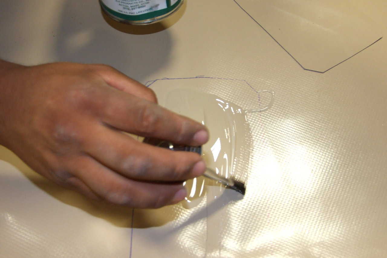 Applying Glue — Glue is applied to the patch area and then to the patch.