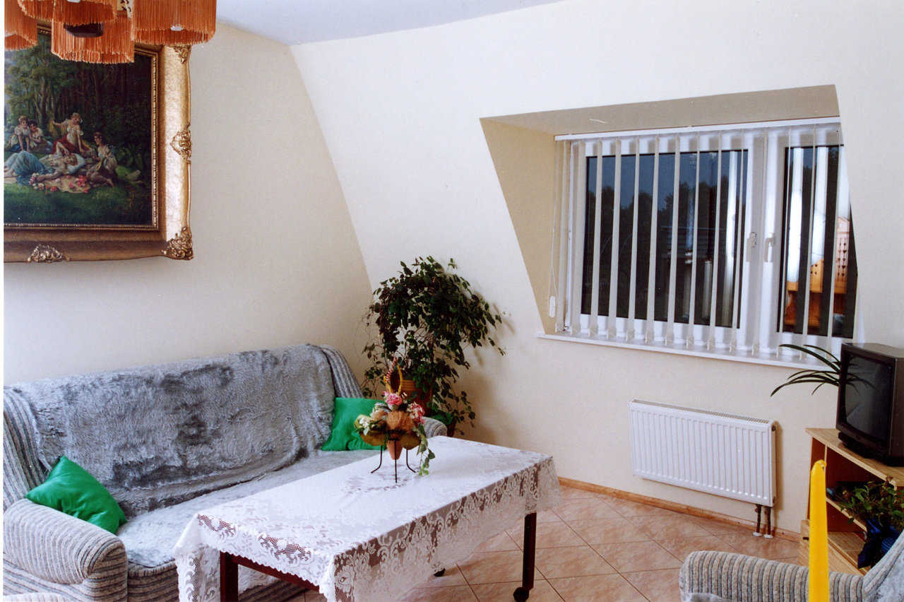 Family room — Jan and his family enjoy their casual TV area.