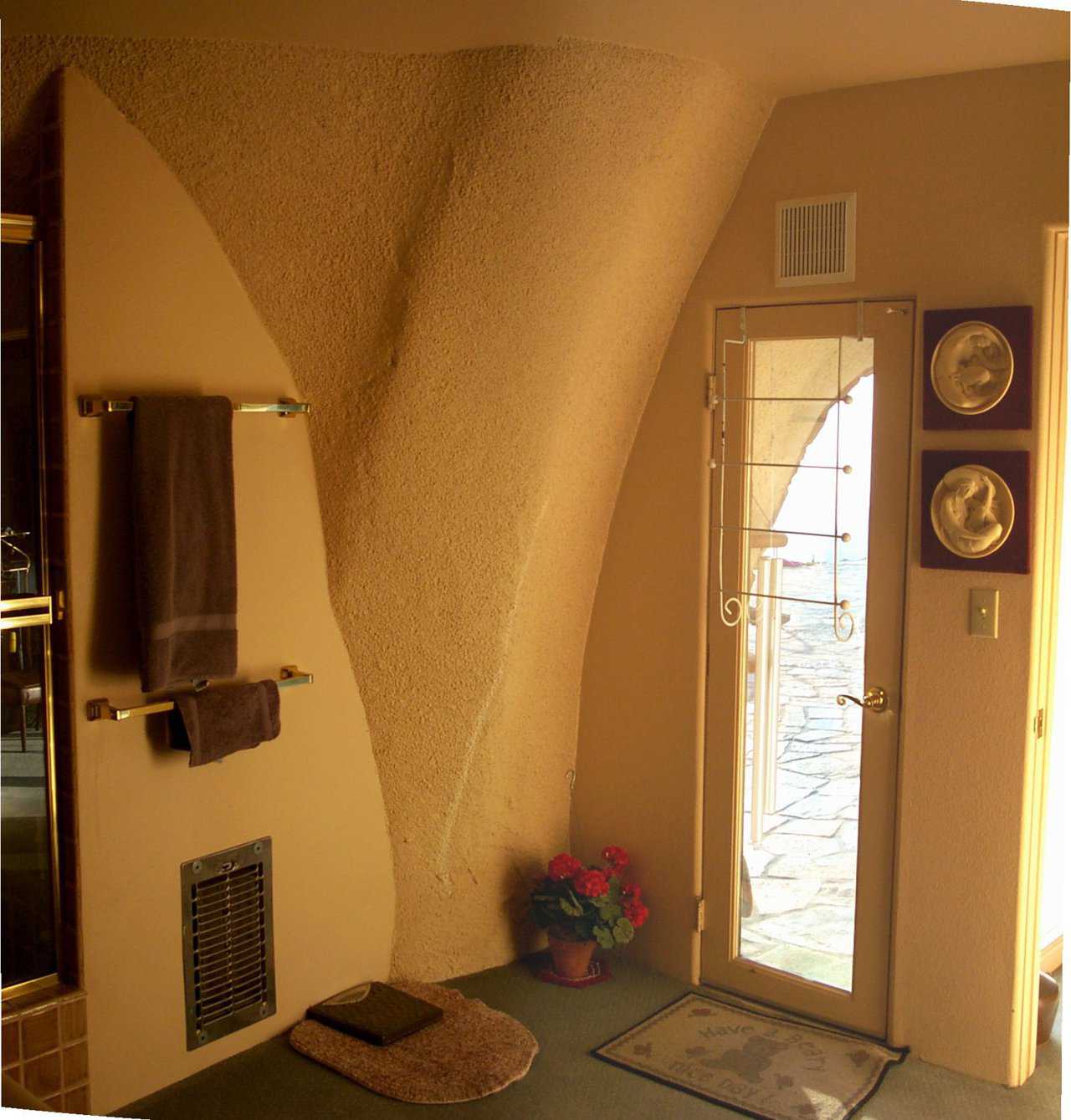 Cozy Bathroom — A small, electric wall heater provides all the heat this bathroom needs.