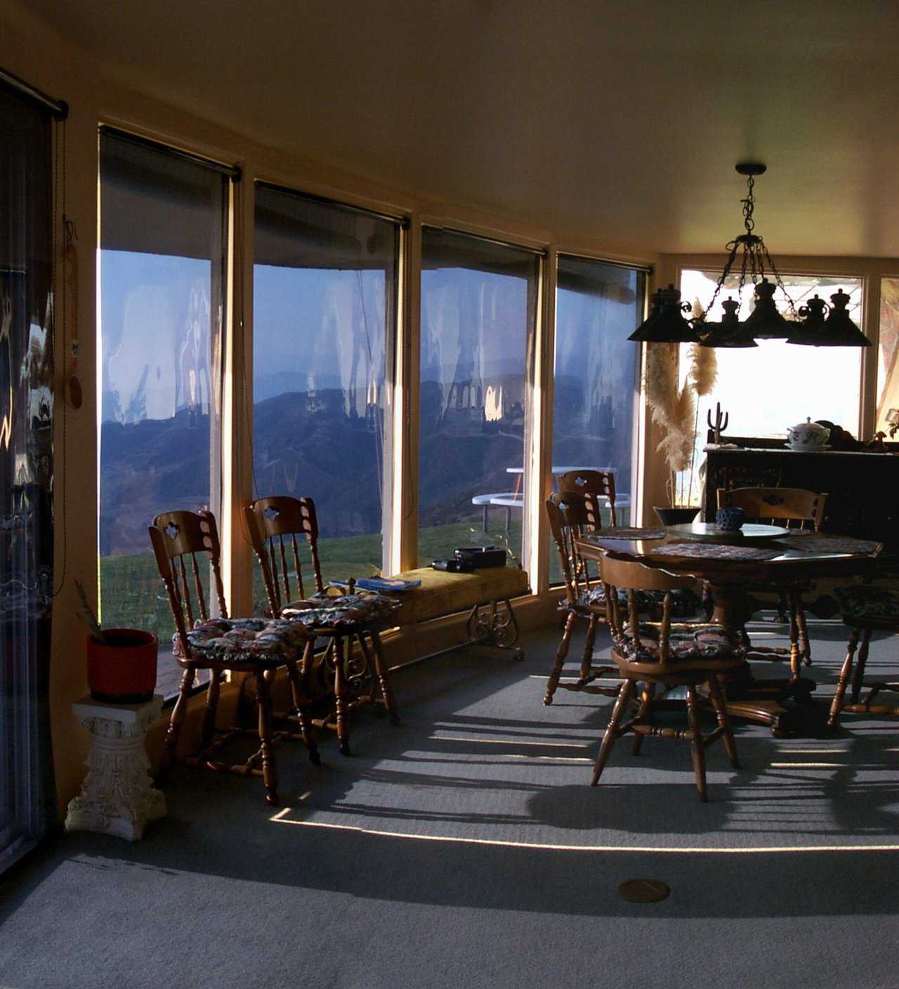 Generous Windows — Every morning, sunshine wakes this inviting breakfast area.