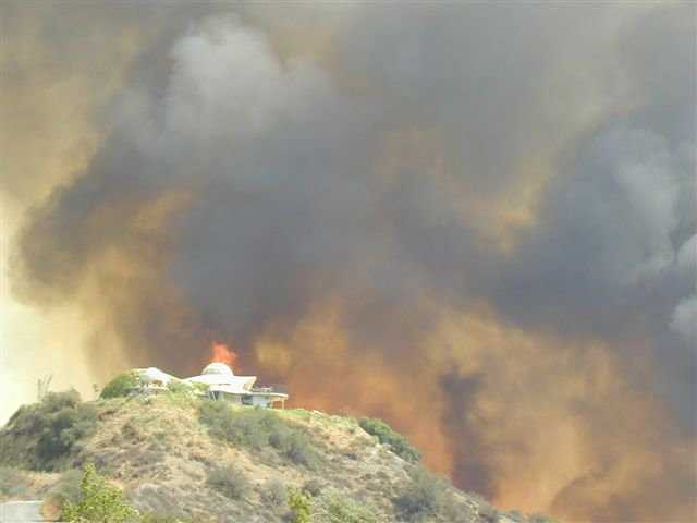 Disastrous Flames — They threatened beautiful Vista Dhome on the afternoon of August 11, 2002.