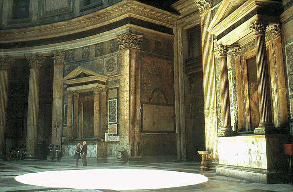 Memorial niches — Along the interior walls, marble columns frame niches with memorial portrait busts.