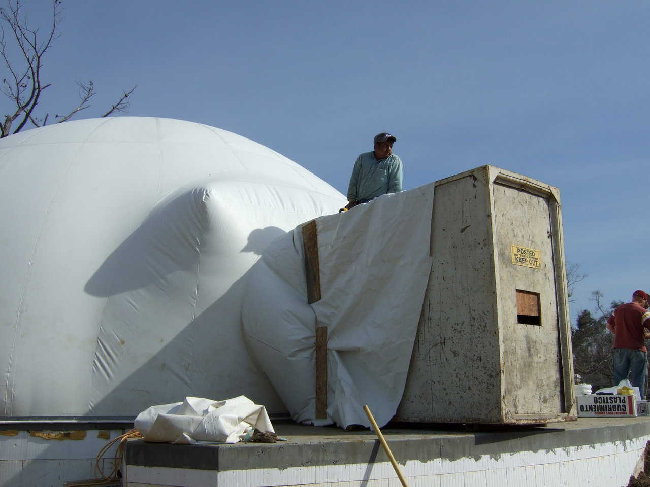 An airlock — Workers attach the Airlock to the Airform.