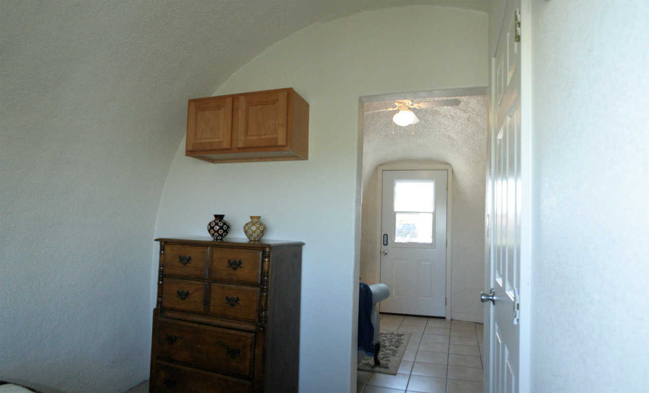 Bedroom in Monolithic Cabin — With a weight of 9 to 14 tons, a Monolithic Cabin can be trucked or barged to virtually any location and set up on virtually any site.