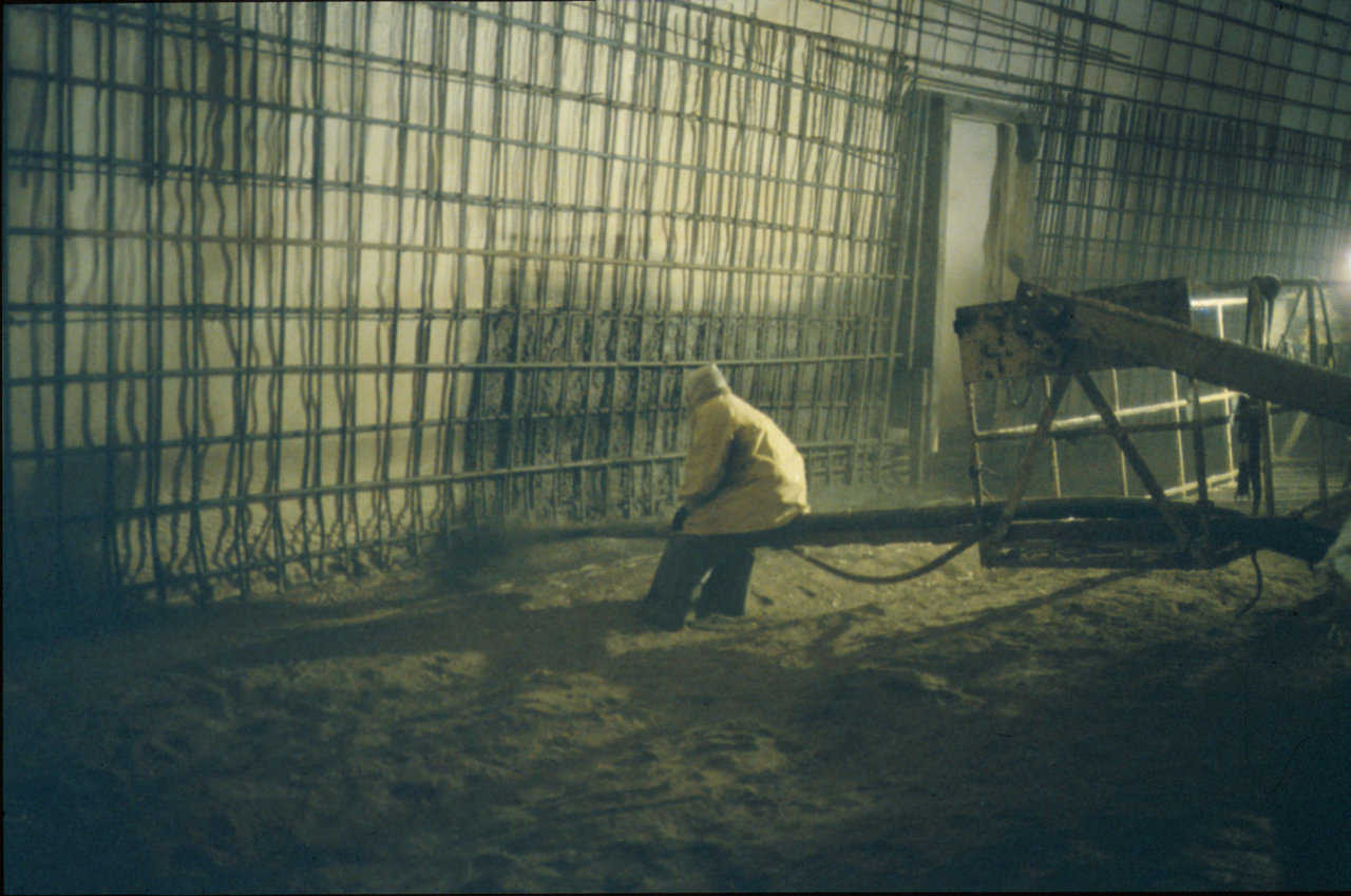 Shotcrete application on a large Monolithic Dome — Shotcrete should be applied in even passes over the entire structure with rebar well-embedded within the concrete.