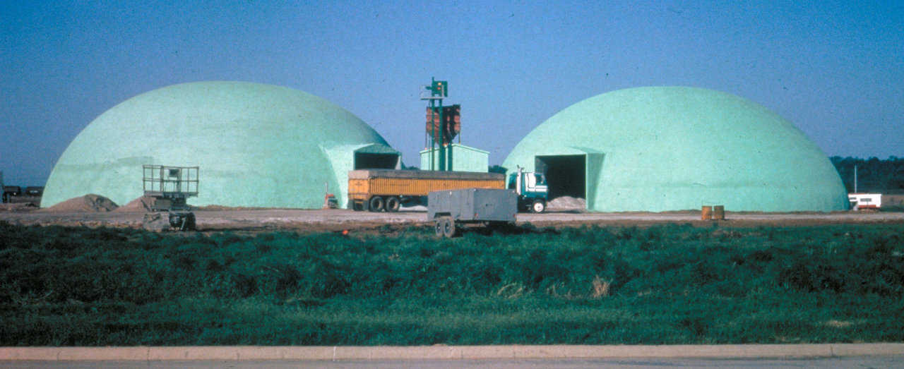 Twin domes – Ford Motor Co. Tulsa, OK — These domes, each with a 105’ diameter are for the storage of cullet, the technical name for broken glass. Furnaces that produce glass work more efficiently when broken glass is mixed with new materials to create new glass. Therefore, cullet is actually made and stored in the domes for future use.