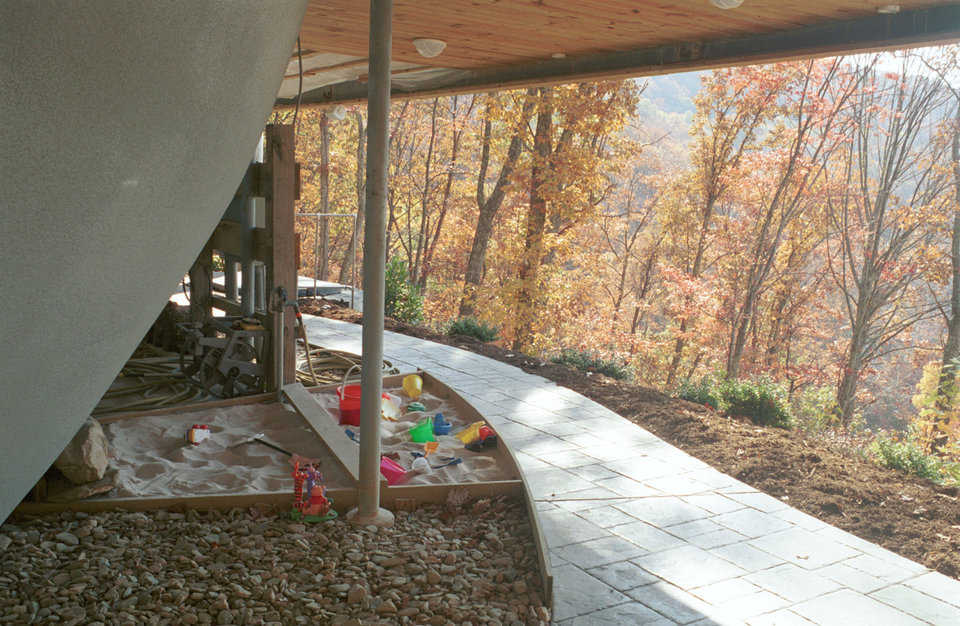 Play Area — The protected space under the dome is Meili’s very own play area, complete with sandbox.