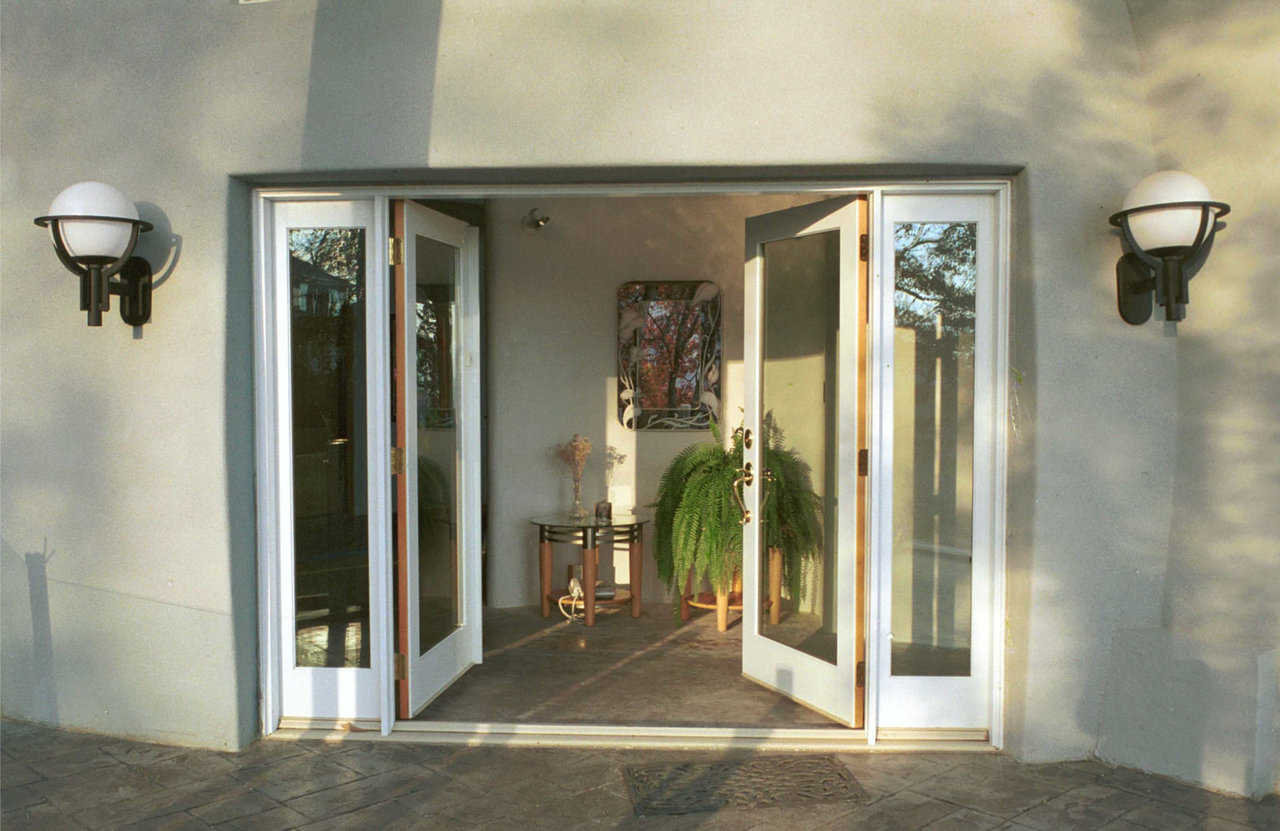 Welcome! — Main entryway features double glass doors. Stamped concrete porch surrounds all exterior levels of the dome.