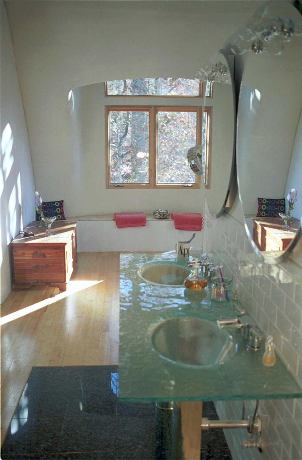 Elegance! — Master bath has a glass double-vanity with waterfall faucets imported from Canada.