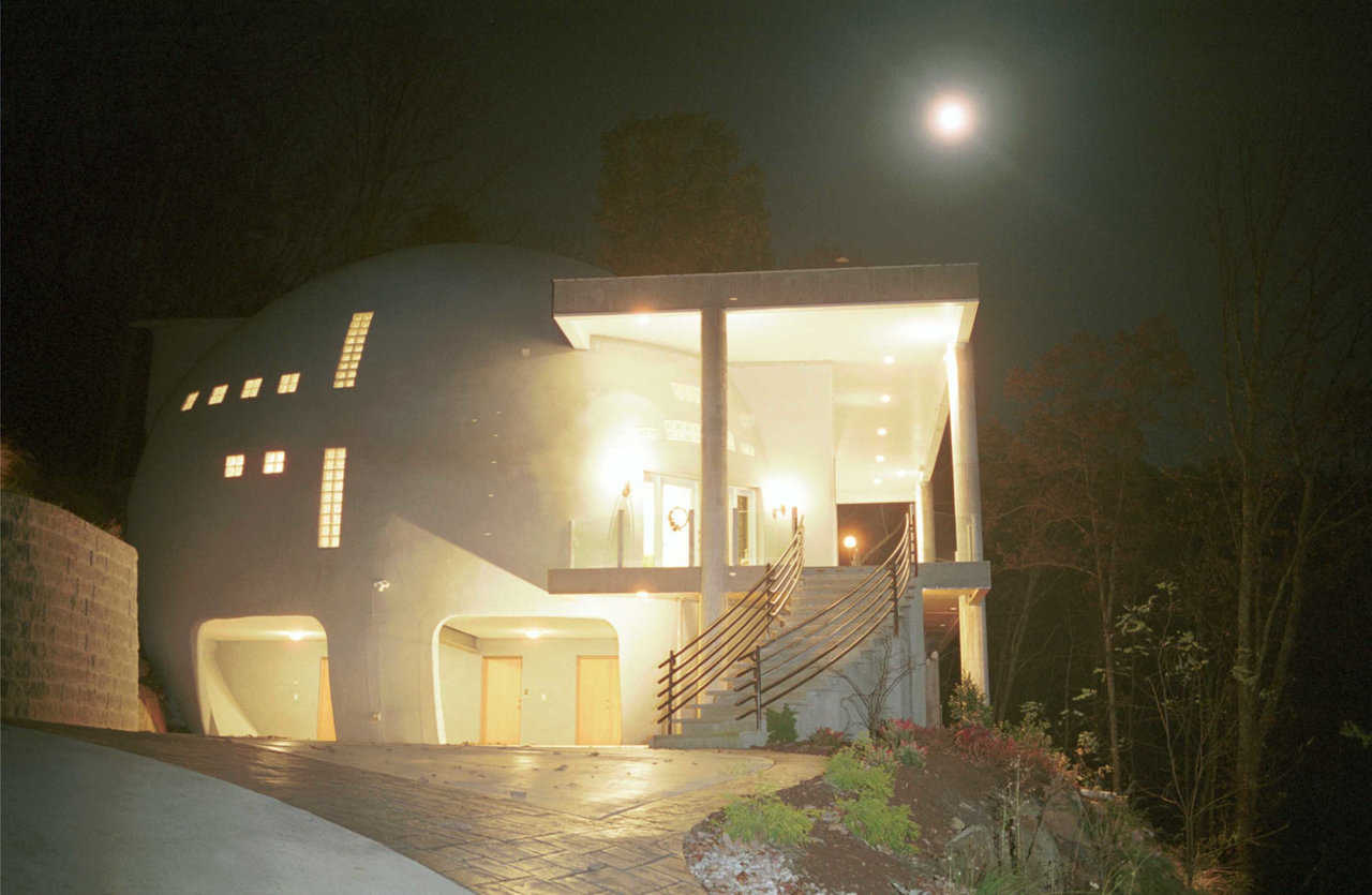 Moon rising over Cloud Hidden — This night-time shot captures the glow and warmth of the home and overcome the myth that domes are cold and cavelike.