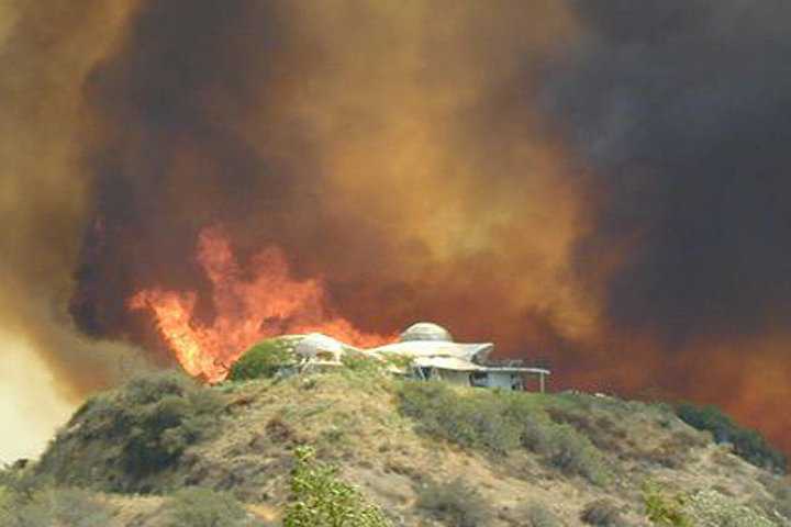 Braswell Fire — Calamesa, California brushfire of 2002.  The Braswells’ Monolithic Dome home was in the direct path 		of the fire but received very little damage.