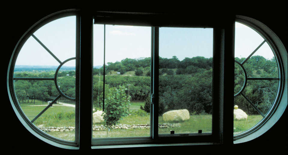 Oval-shaped window — This oval-shaped window reflects the shape of this Monolithic Dome home in Bandera, Texas.