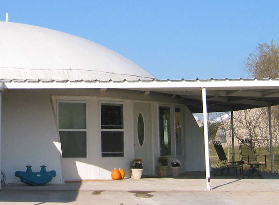 Inset cutouts — These inset windows and door help to create a beautiful, shaded entryway.