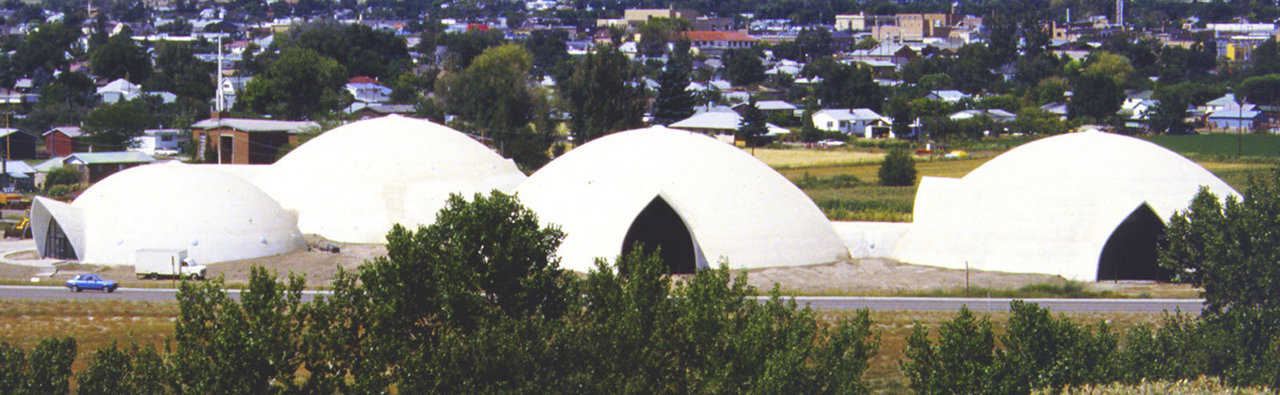 Gothic arches — Four interconnected Monolithic Domes serve as the Public Works Complex for the city of Price, Utah. Cylinder openings connect the domes and give each a Gothic entryway.