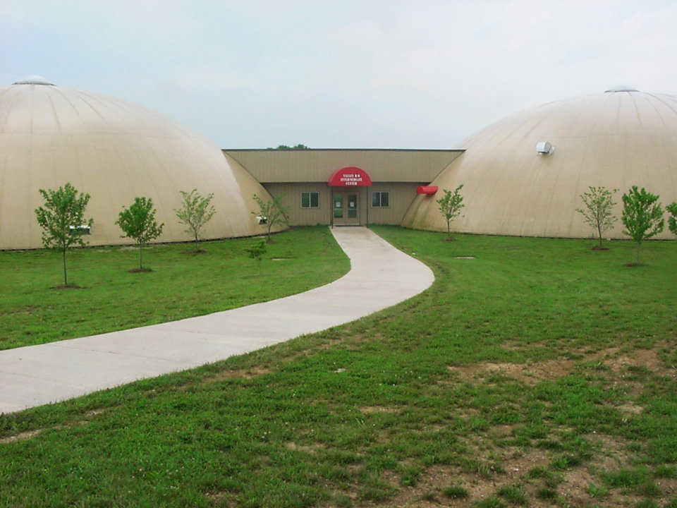 Monolithic Domes in Caledonia, Missouri — Voters approved a bond for construction of three Monolithic Domes, two to house classrooms for grades 3 through 6 and one as a gym.
