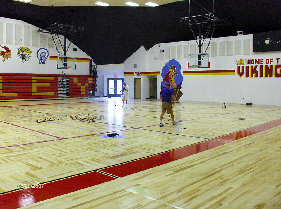 Monolithic Dome Gymnasium — It includes seating for 1000, two regulation cross courts, direct lighting and an acoustic drop ceiling.