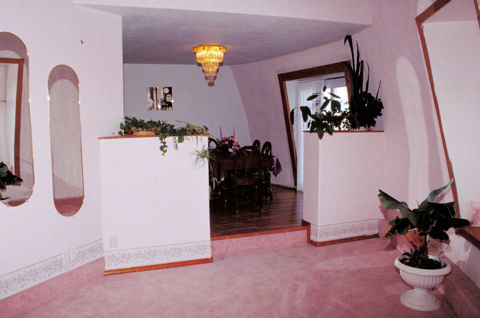 Beautiful finishes — Some areas, such as the dining room, have a simulated oak floor. Real hardwood was used for the baseboards and trim throughout the house.