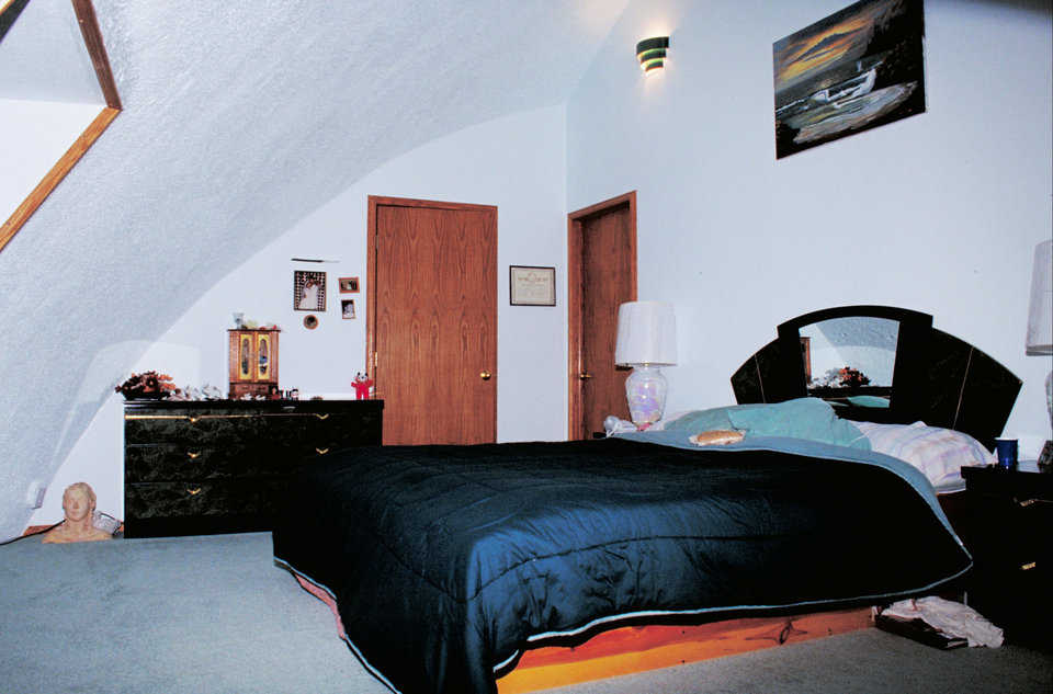 Master suite — This spacious bedroom includes a curved ceiling and bay windows.