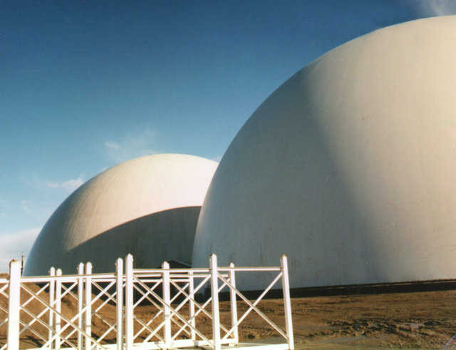 CALAMCO — These two domes, which are each 230 feet in diameter and 115 feet high, were built for the California Ammonia Co. (CALAMCO). Each dome is big enough to hold 600 semi-truck loads of apples.