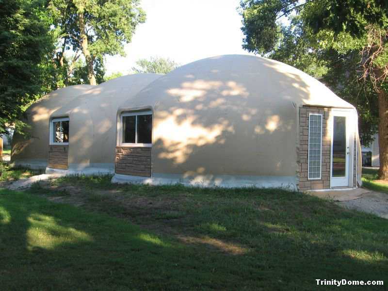 Trinity Dome — It has a Caterpillar-like design of three interconnected domes, each with a diameter of 24 feet, a height of 13 feet and a total area of 1232 square feet. Accent siding was installed below the north-side windows and the front entry. The stone look complements the Airform fabric.