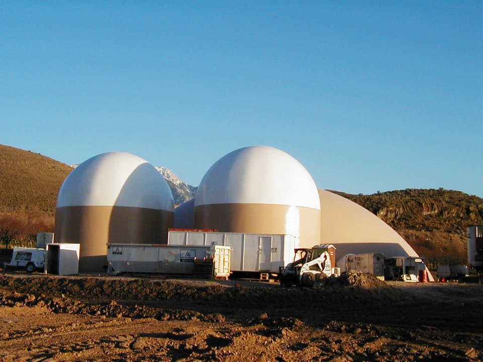 Towerlike Domes — Using the Monolithic process, two towerlike domes, each measuring 30′ × 15′ were built atop 17’ cylindrical stemwalls. The domes house a kitchen, cafeteria and resource center.