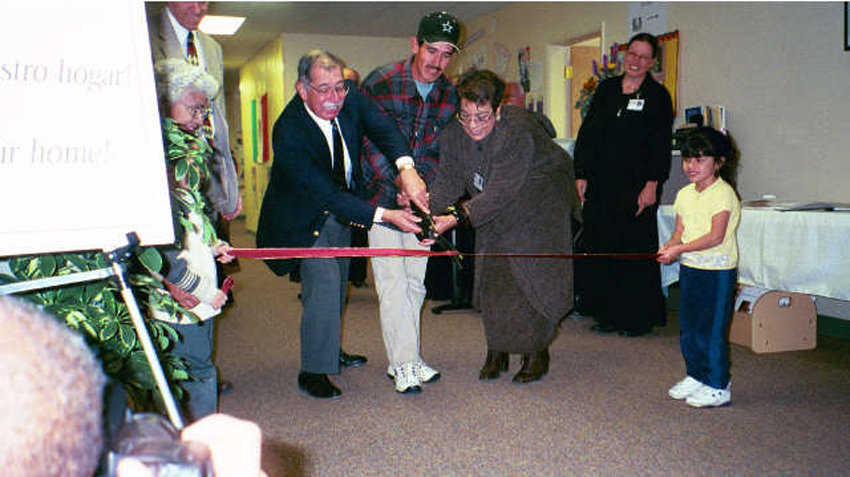 Grand Opening — Children as well as directors participated in the ribbon cutting on opening day.