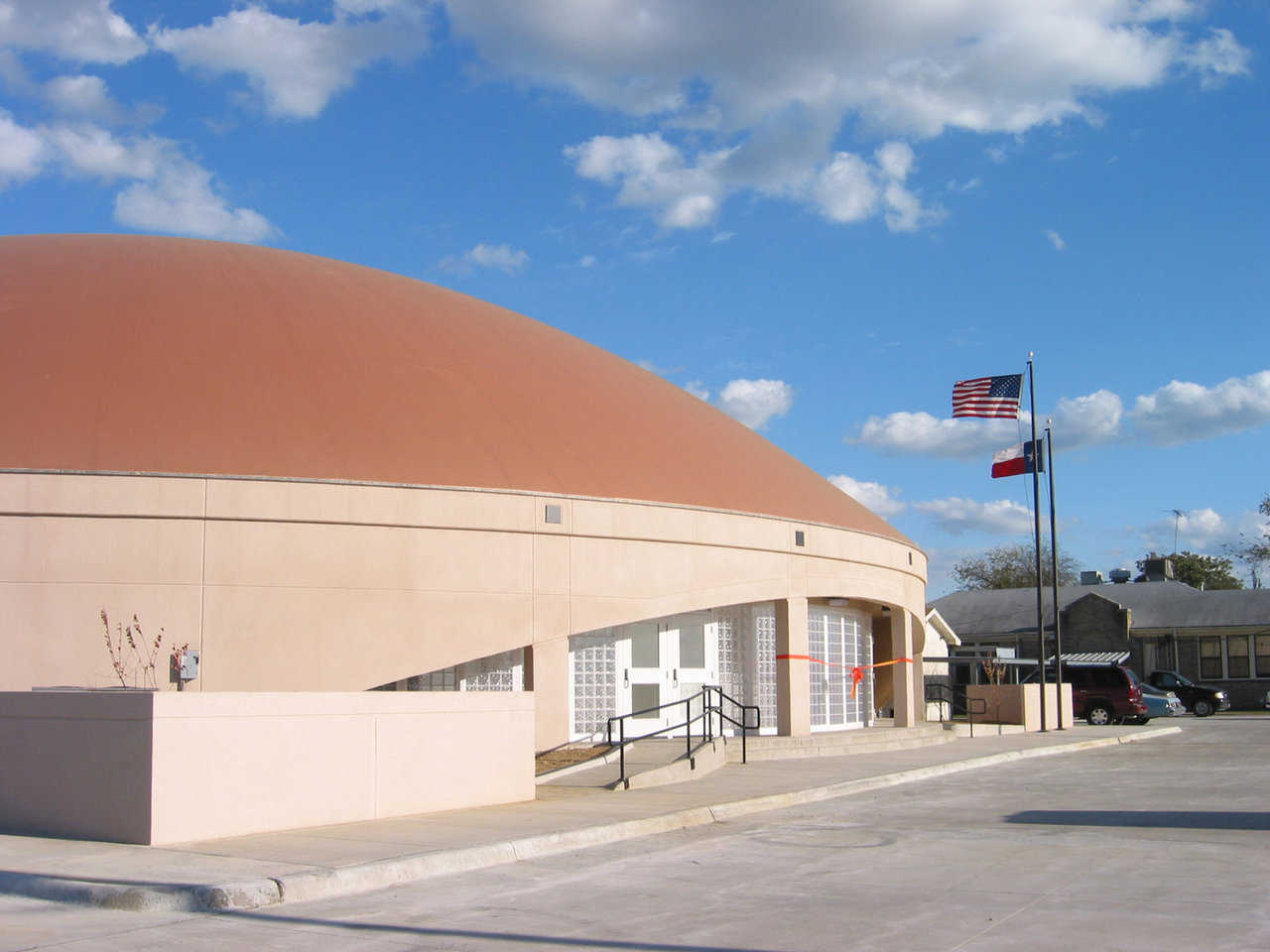 Ready for ribbon cutting! — At the dome’s front, Avalon flew the U.S. and Texas flags and strung ribbon across the doors.