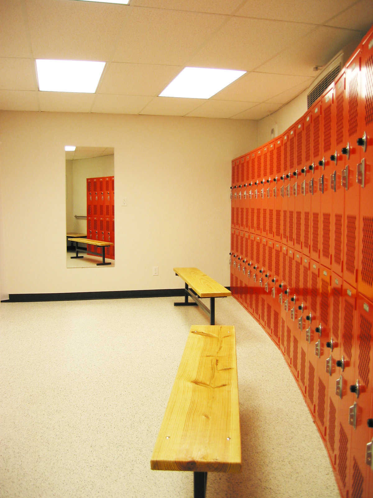 Neat storage — Large lockers outline the perimeter of the facility’s four locker rooms.