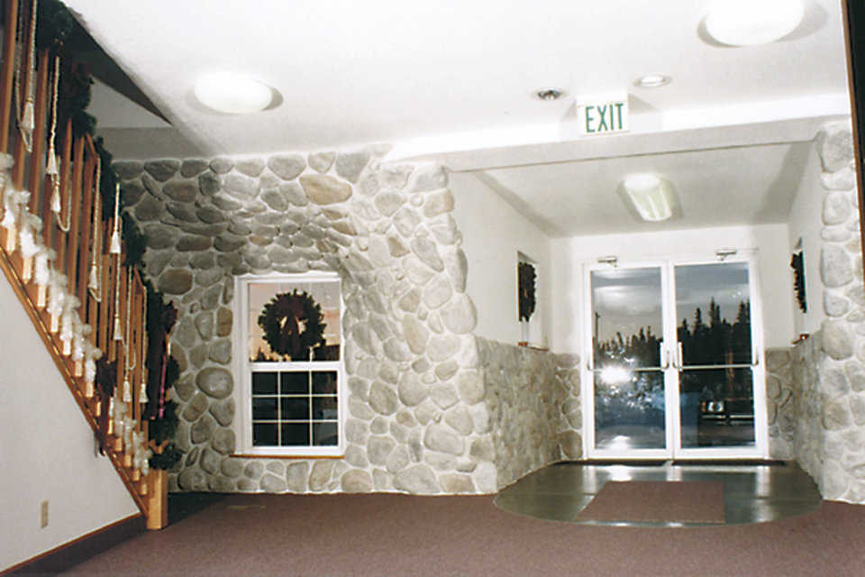 Interior Entryway — It has an attractive, inlaid rock wall.