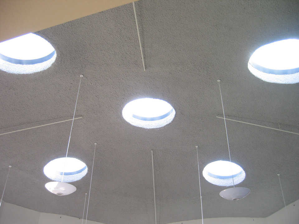 Let there be light! — The dome shell has inset skylights and hanging light fixtures.