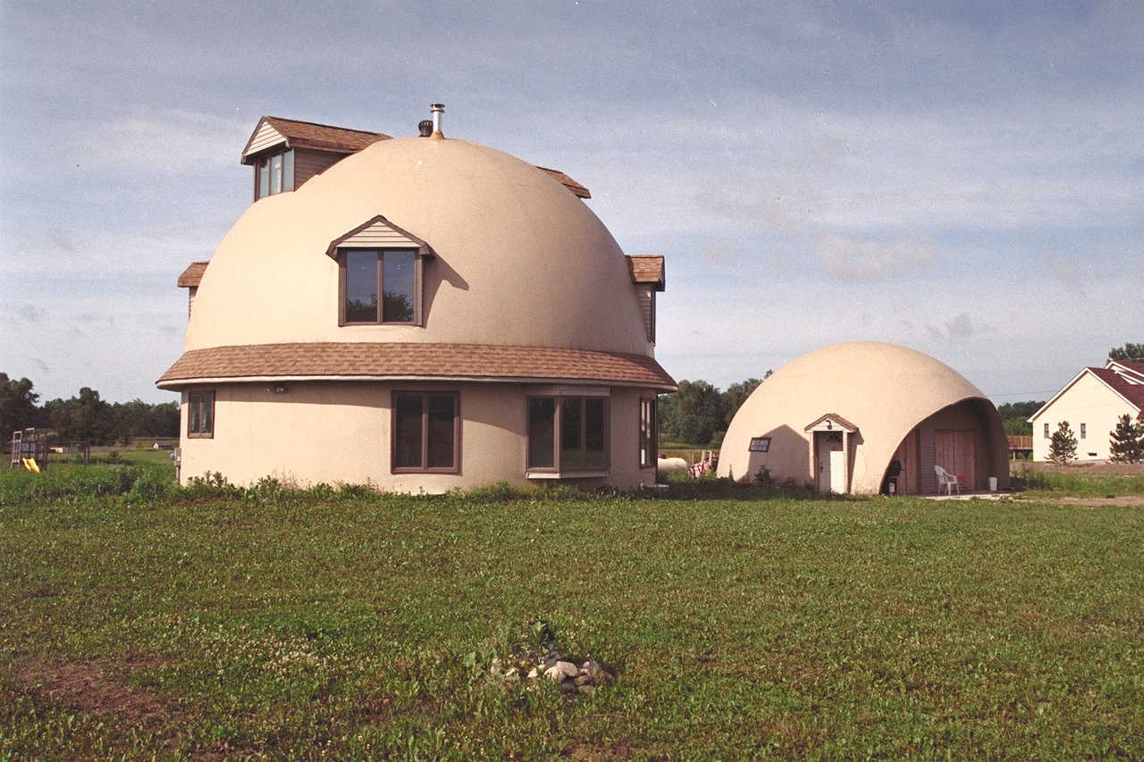 House built of credit cards — The two-dome home of the Gary E. Clark family of Ann Arbor, Michigan is a 36’ hemisphere on an 18’ stemwall, buried 9’ into the ground.