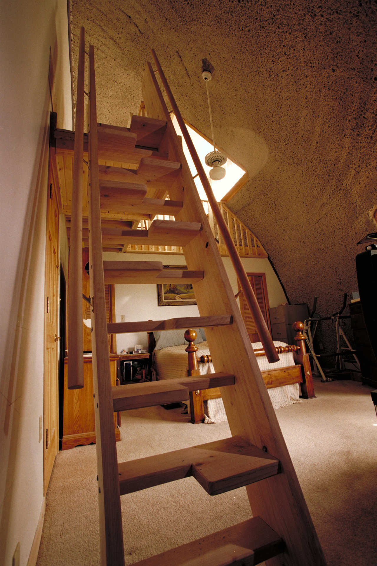 Monk staircase — Width on each step alternates from left to right. This enables the staircase to be much steeper, almost like a ladder, and still “feel” like a regular staircase when climbing or descending.