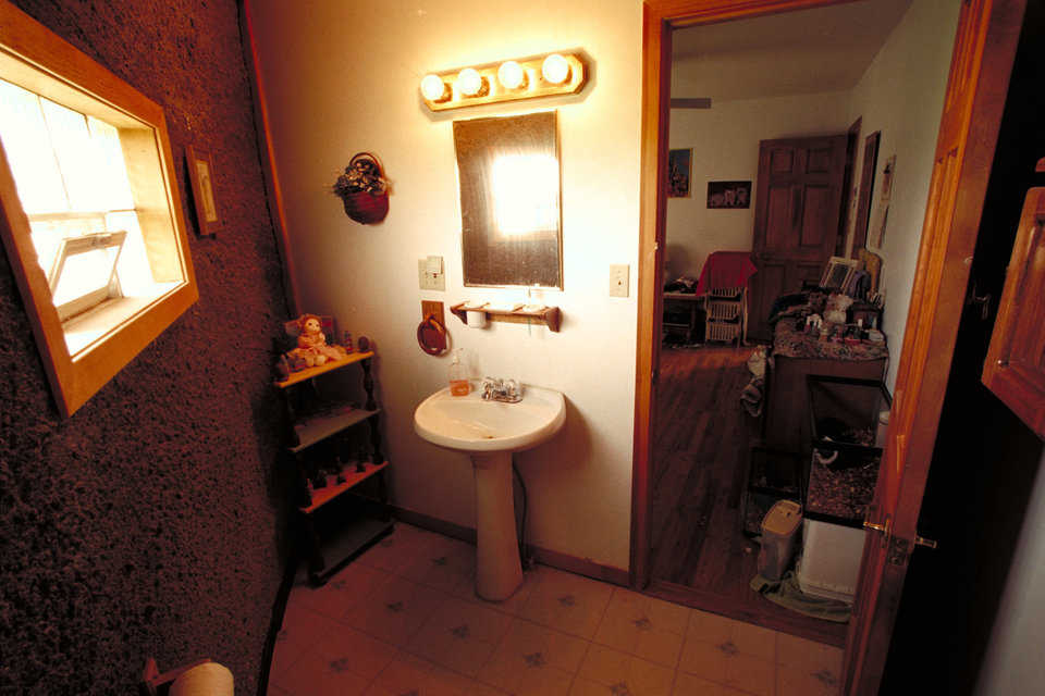Bathroom — The Clarks utilized space near the dome wall in the bathrooms.