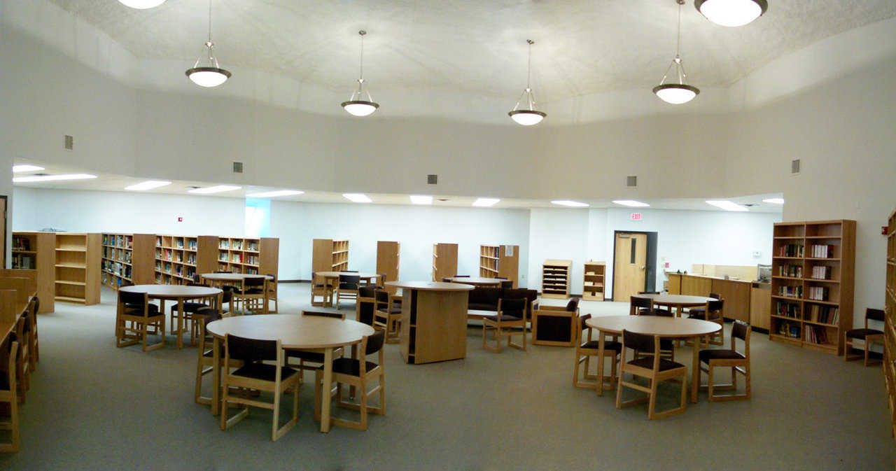 Library — Good lighting and roominess make this an ideal spot for studying and reading. Library lighting includes 7 pewter chandeliers.