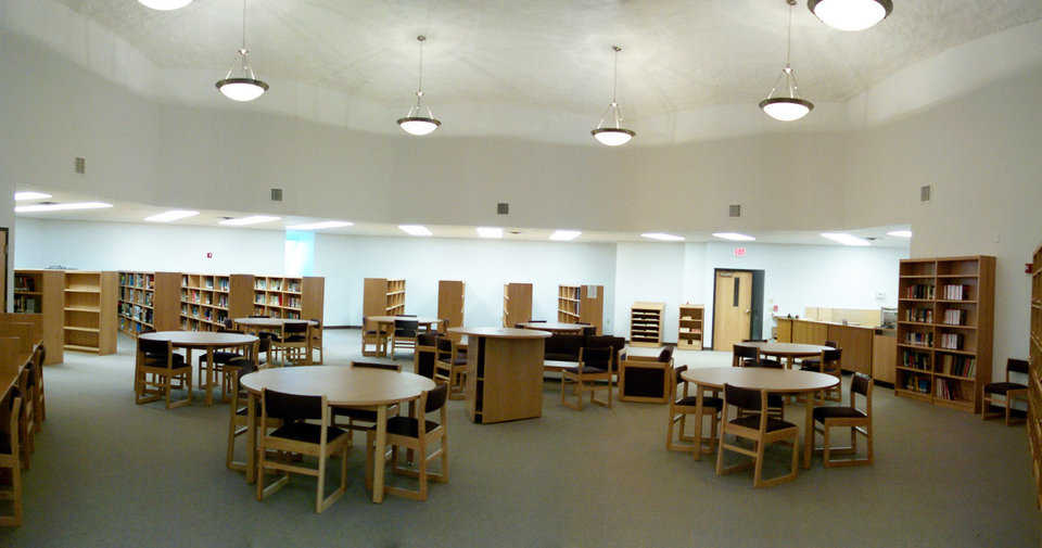 Library — Good lighting and roominess make this an ideal spot for studying and reading. Library lighting includes 7 pewter chandeliers.