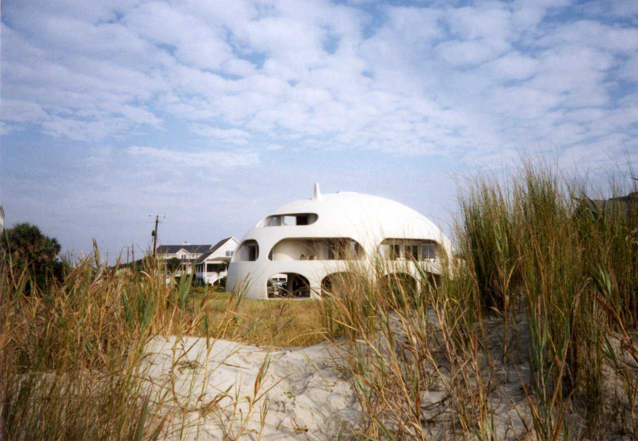 Eye of the Storm — View of “Eye of the Storm” dome home from the beach on Sullivans Island, SC. The “Eye of the Storm” is much more than a pretty house, it also demonstrates the practical aspects of a Monolithic Dome on beach front property.