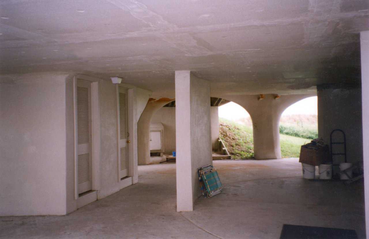 Garage — The bottom floor is completely open and the upper floors are actually suspended from the dome. During severe weather, storm surge can fill the entire garage without damage to the living spaces above. Repairs costs are limited to only the minor walls in the garage.