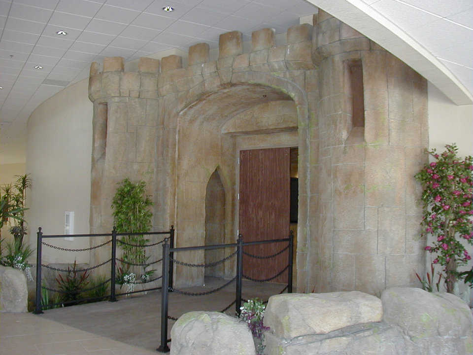 Castle Entrance — A bridge crosses the moat and leads to the theme dome’s entrance.