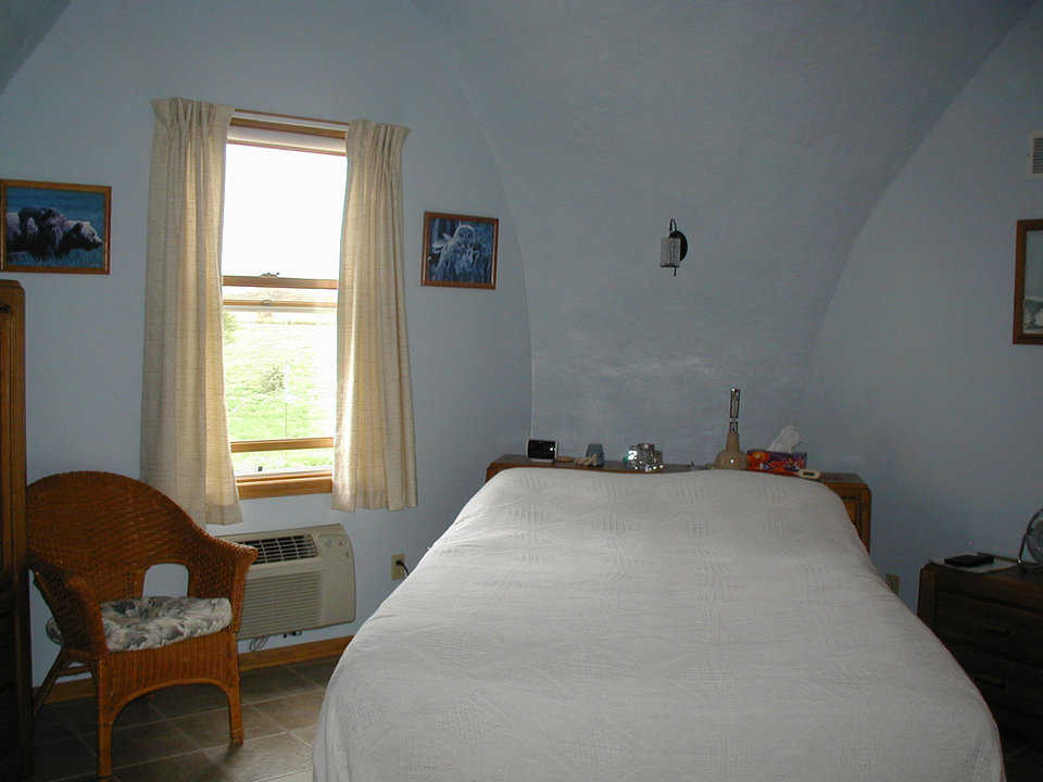 Bedroom — The master bedroom has light, easy-to-move-and-maintain furniture.