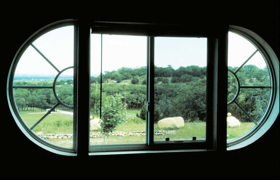 A bit of Texas — The curved window gives the residents of this Monolithic Dome home a lovely view.