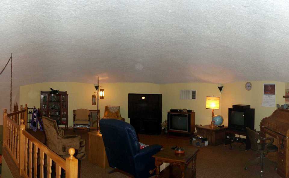 Loft family room — Boyd has a small collection of televisions from small to an extra large big screen. Inner walls in the loft provide flat wall space.