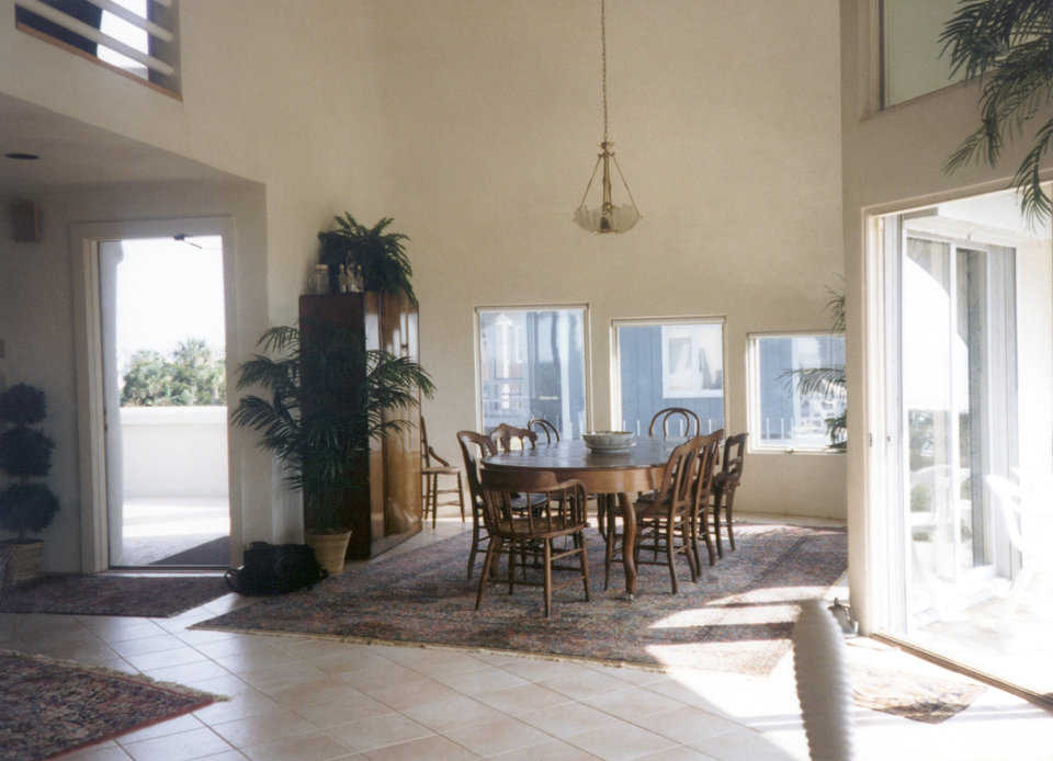 Dining area — It’s located just to the right of the main entrance. The 3 progressively smaller windows create an interesting accent.