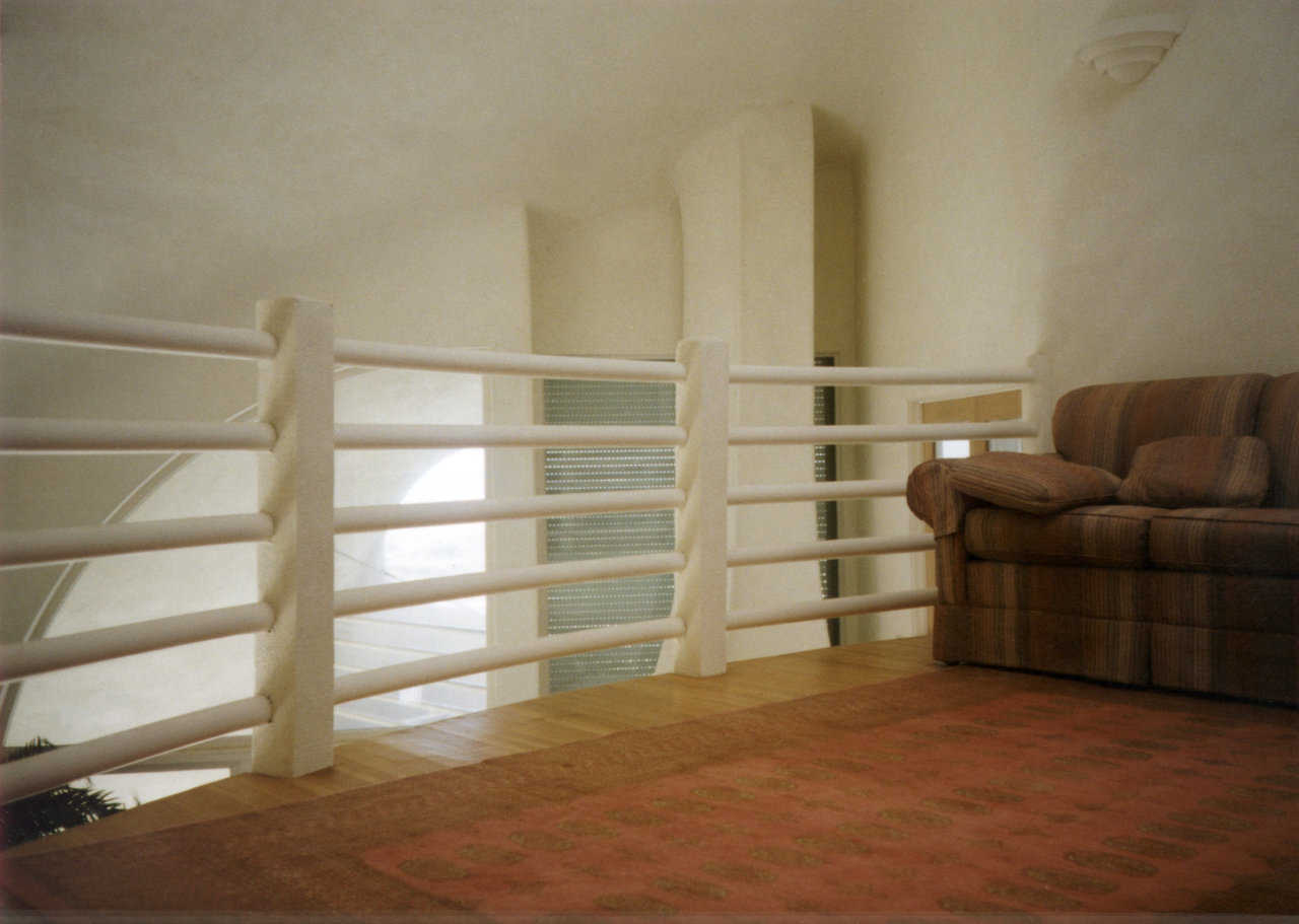 Third floor comfort — This sitting room is suspended over the second level and flooded with sunshine coming through the skylight.