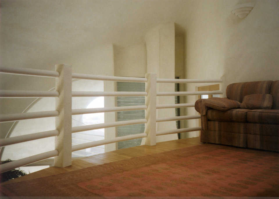 Third floor comfort — This sitting room is suspended over the second level and flooded with sunshine coming through the skylight.